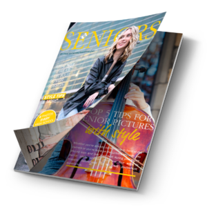 A magazine titled "SENIORS" is open, featuring a high school senior girl with blonde hair smiling and playing a cello on the inside. The headlines include topics on senior pictures, style tips, and a section on how to capture photos style. Provided as a free download by Paul Manoian Photography.