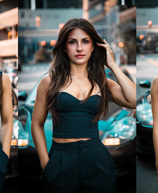 A woman with long brown hair, wearing a dark pinstriped outfit, poses confidently in front of a teal sports car on a city street in three different shots.