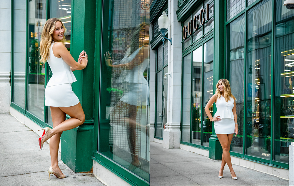 Senior Pictures Outfit Ideas for Girls in 2026: A high school senior girl in a white dress and heels poses smiling outside a green-framed storefront with large windows, one photo showing her leaning against the window, the other standing with hands at her sides.
