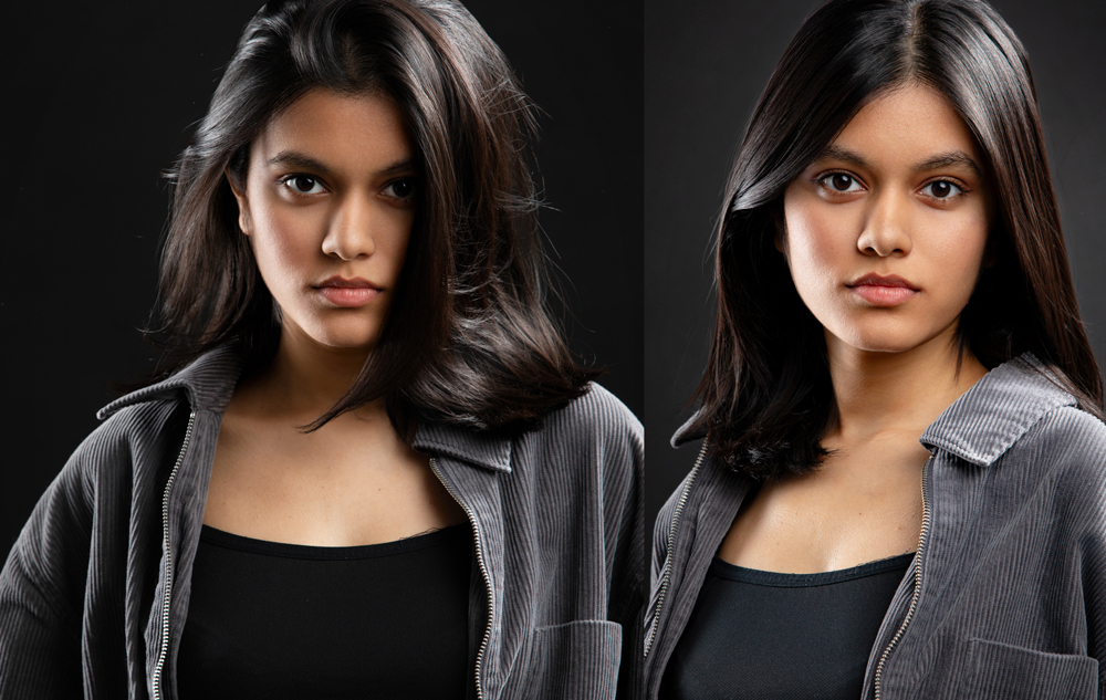 Two young women with medium-length dark hair wearing gray jackets and black tops stand against a dark background, looking directly at the camera with neutral expressions—captured by an Ann Arbor Actor Headshots Photographer.