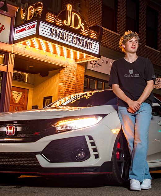 Chelsea senior pictures featuring a Honda Civic Type R in front of the new JD's Stage Bistro marquee in downtown Chelsea, Michigan.