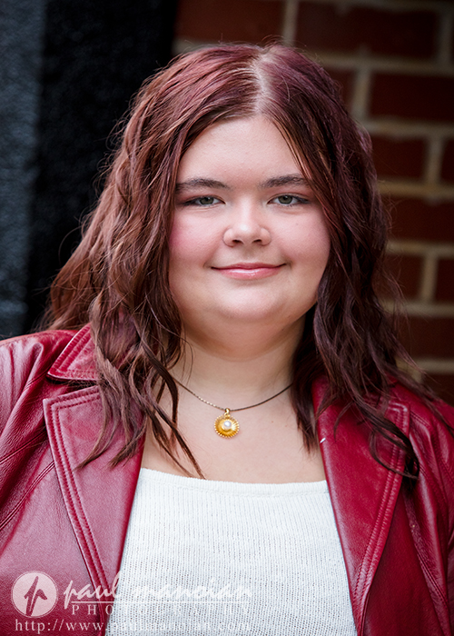 Close-up Class of 2027 senior portrait in downtown Plymouth