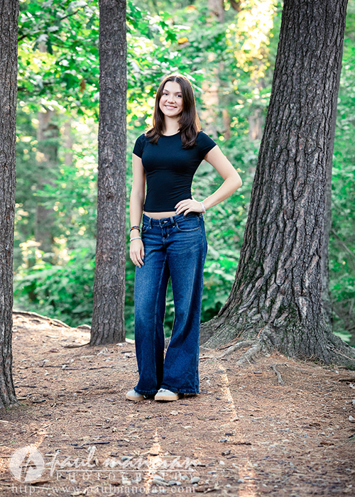 Outdoor senior pictures among trees near Ann Arbor