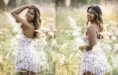 In a sunlit meadow near Ann Arbor, a high school senior with long hair poses gracefully in a white dress adorned with pink flowers. Captured in two side-by-side images, she smiles warmly at the camera amidst the tall, sun-dappled grass, embodying the essence of senior pictures.